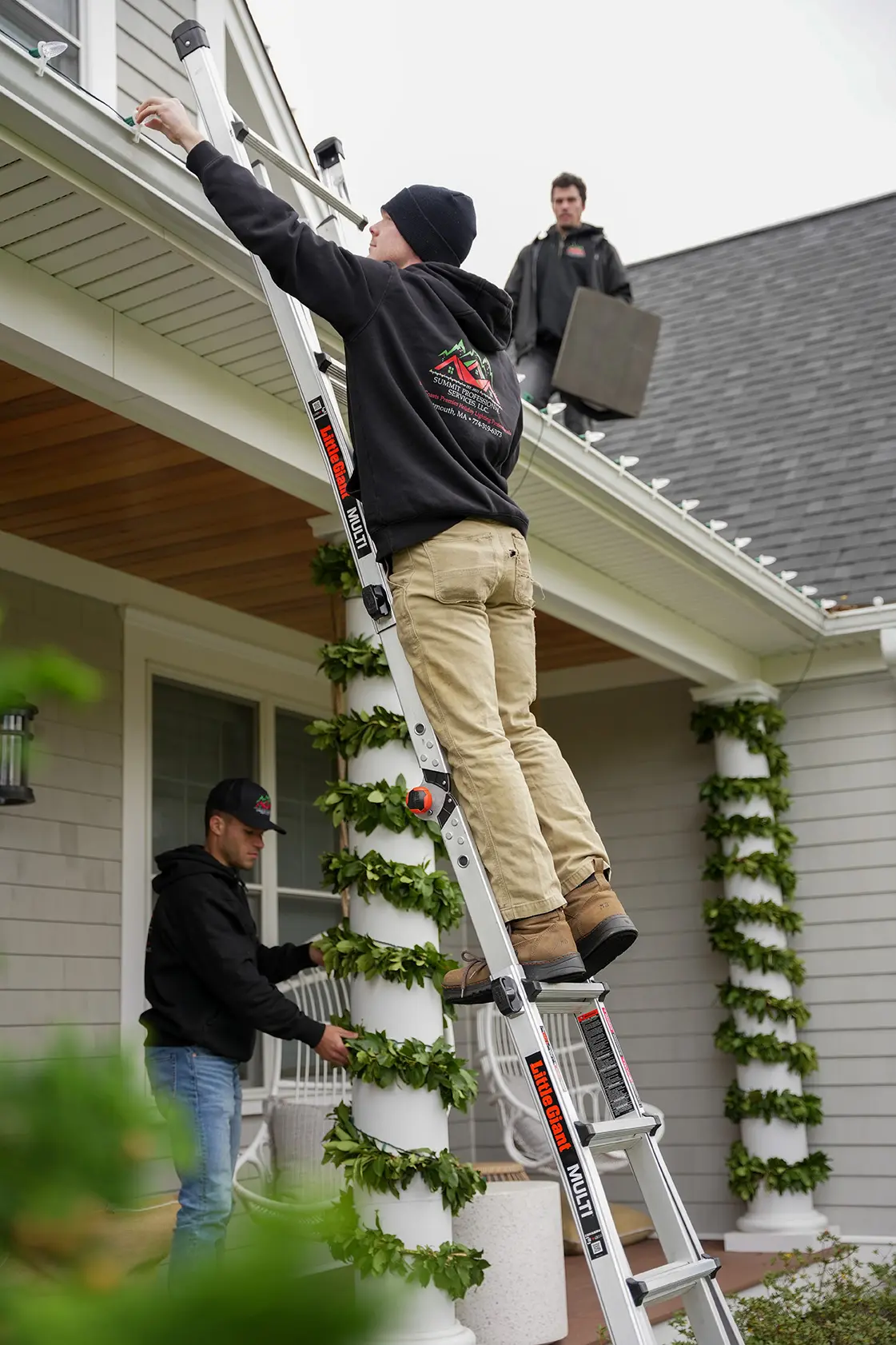 Summit Holiday Lights team installing lights