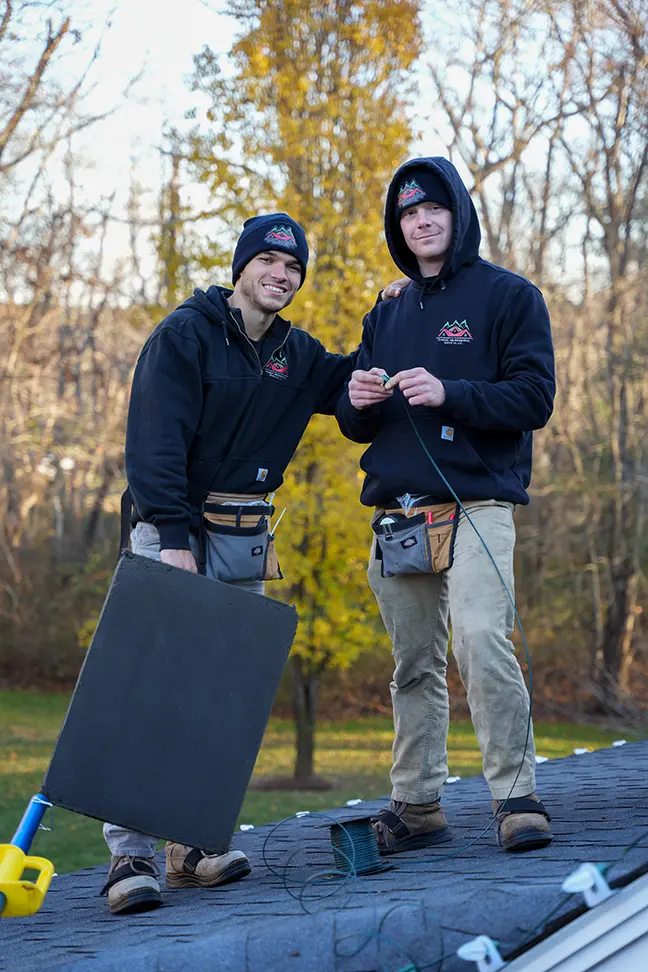 Dustin and Max smiling while on the roof